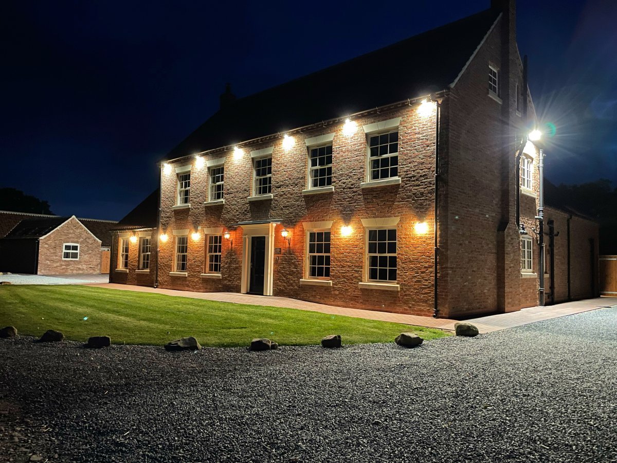 Pasture House - lit up at night